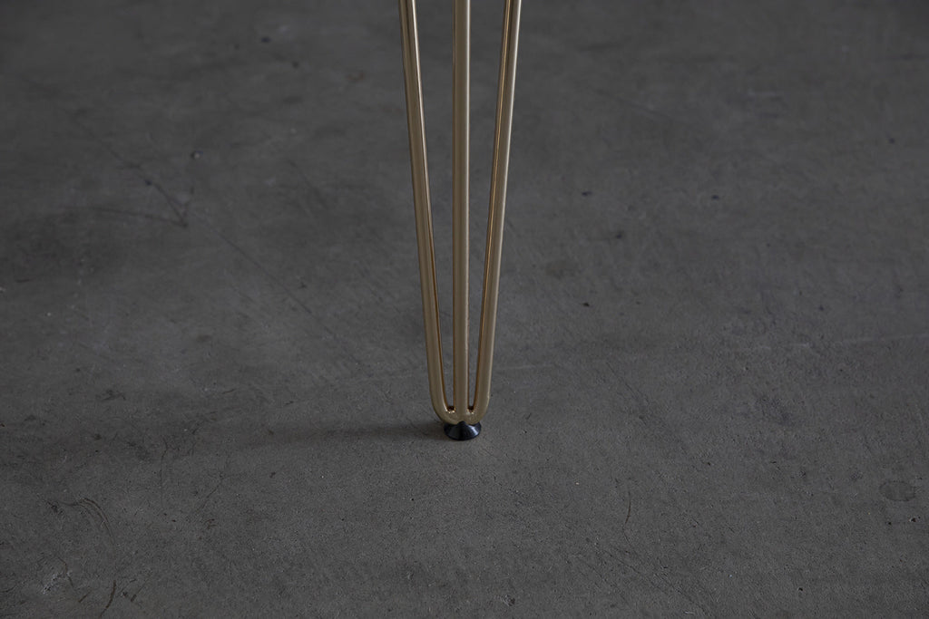Close-up van Nordstahl Hairpin bankpoten goud
