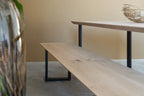 Detail van Nordstahl U leg onder een houten eettafel